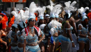 http:  taishimizu.com pictures brooklyn west indian canival parade nikon 80 200 f 2 8 af d white feathers thumb.jpg